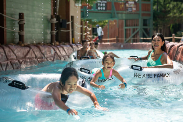 Cataloochee Creek Adventure River with family floating down the lazy river. Feature image for outdoor waterpark page for reference.