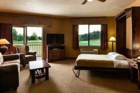 murphy bed and chairs in stone hill lodge