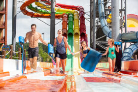family exiting the mat racer slides at lake wilderness