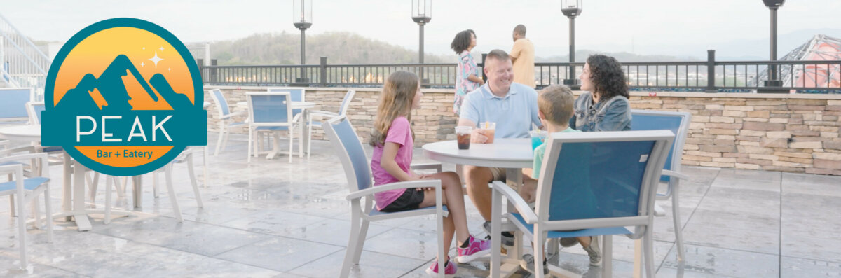 family having dinner at peak bar and eatery