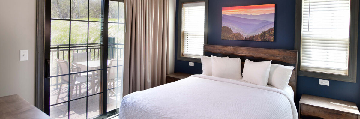 bedroom and king bed in 4 bedroom mountainside cabin