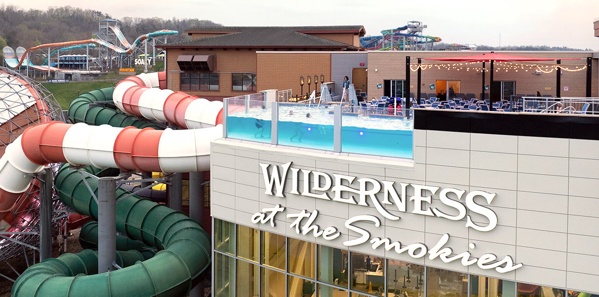 Lookout Lagoon roof top pool Wilderness at the Smokies. Image shows rooftop pool with swimmers enjoying the outdoor weather. Used as a banner to show view and location on pool website page.