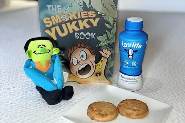 Spooky Bedtime Story Package Special shows toy, book, mild, and cookies included. Gallery image for website.