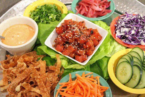 Aloha 2026 gallery images of pork, tiki cups, mahi mahi, and the cabana. Rotates threw to show the VIP options for the New Year's Eve Aloha 2026 Cabana Special.