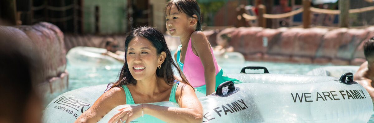 Lake Wilderness banner of family floating in Cataloochee Creek Adventure River. Banner image used on outdoor waterpark website page.