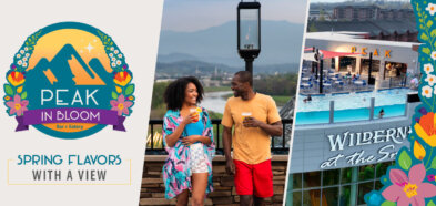 A couple enjoys drinks with a mountain view at 