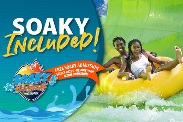 Two guests ride a yellow tube slide at Soaky Mountain Waterpark beside text reading “Soaky Incube!” with an offer for free Soaky admission on select dates with resort-wide accommodations at Wilderness at the Smokies.