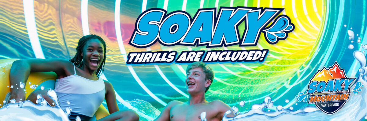 Promotional banner for Soaky Mountain Waterpark featuring a smiling young woman and man riding a yellow raft through a vibrant, neon-lit water slide tunnel. The text 