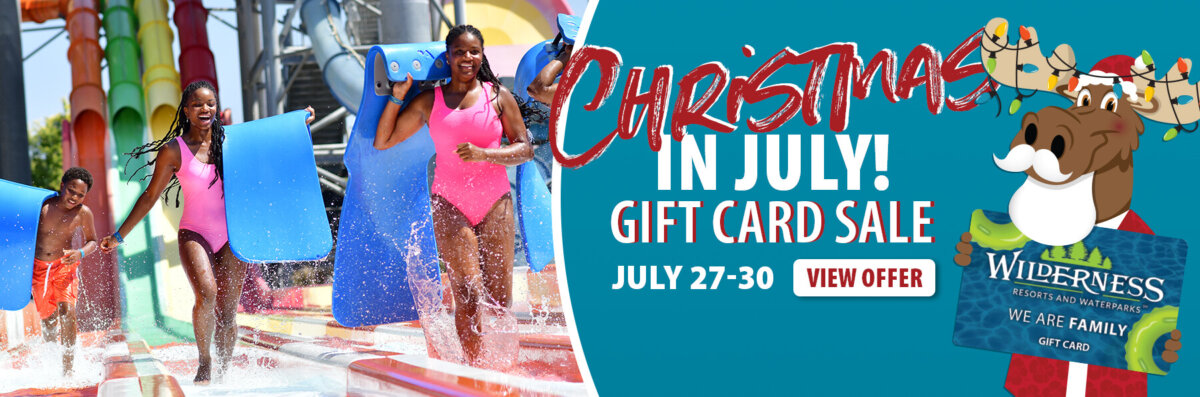 Kids with matts getting off a water slide. Copy reads: Christmas in July Gift Card Sale. July 27-30