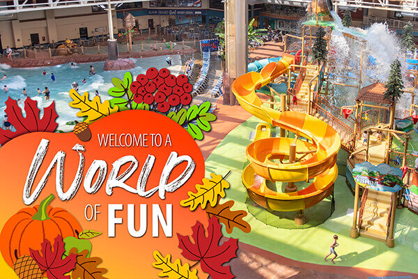 Fall-themed banner featuring an indoor waterpark with colorful slides and play structures. Text reads, “Welcome to a World of Fun.”